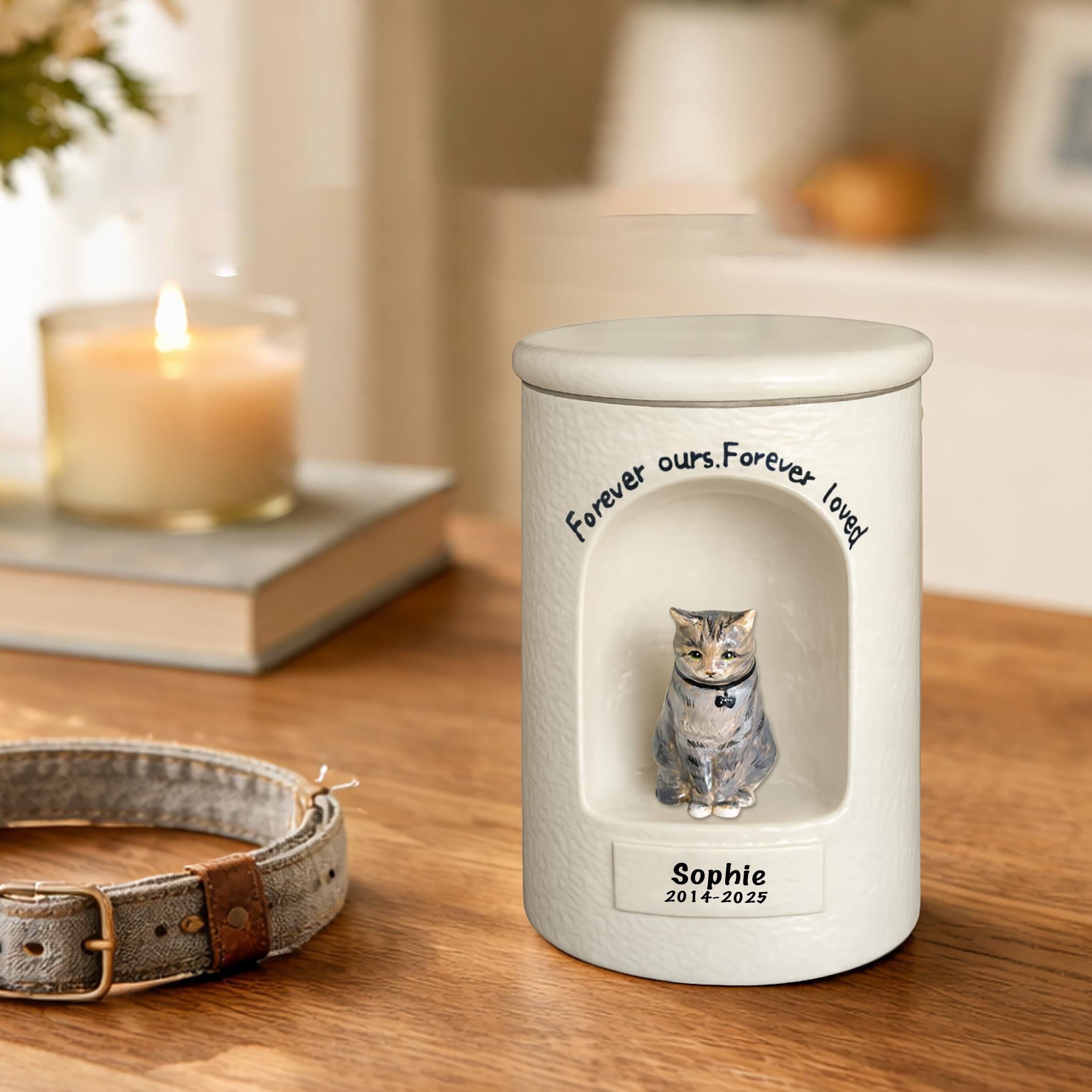 White cat memorial urn with blue-gray cat figurine and engraved name and dates