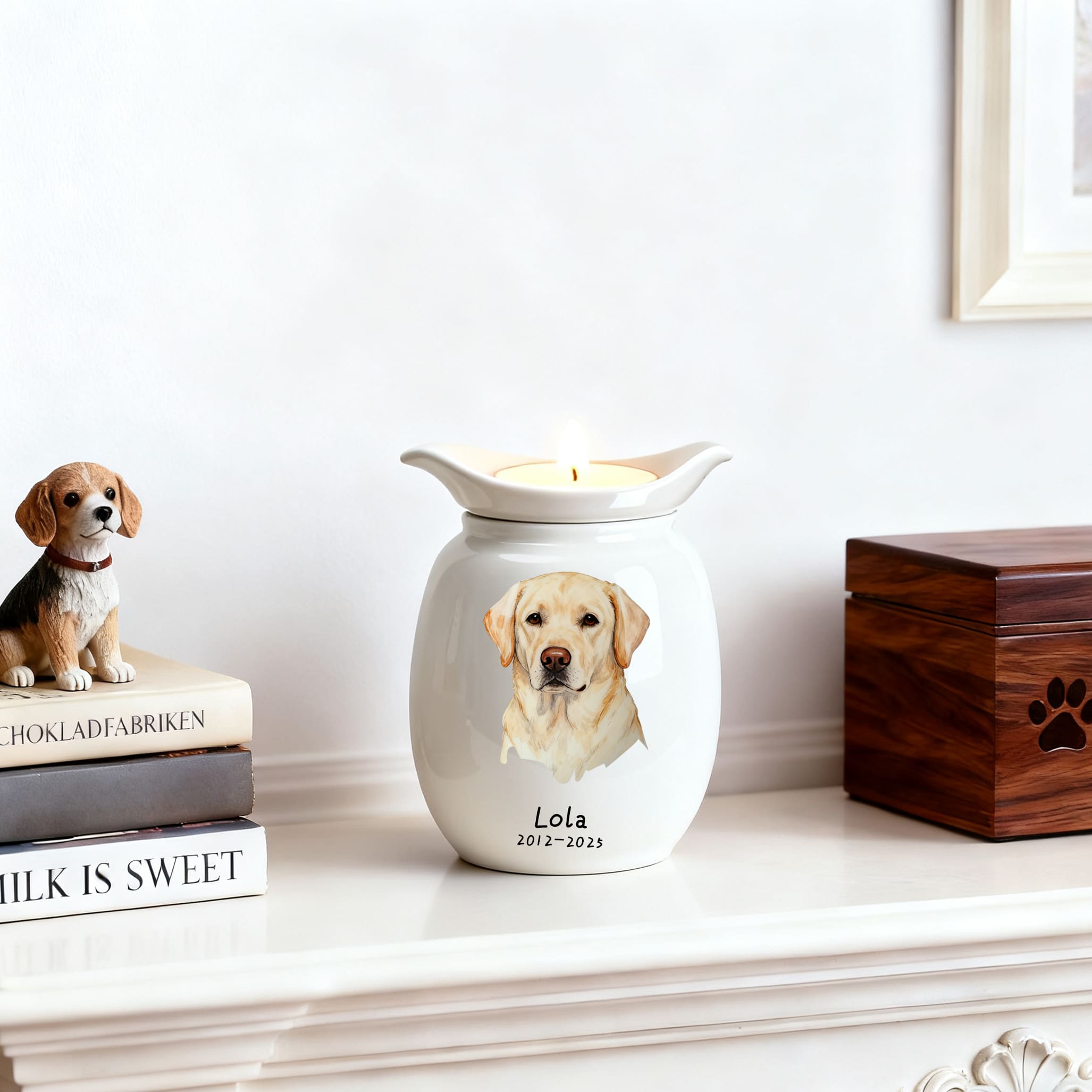 White ceramic dog memorial urn with candle; painted dog portrait and name Lola