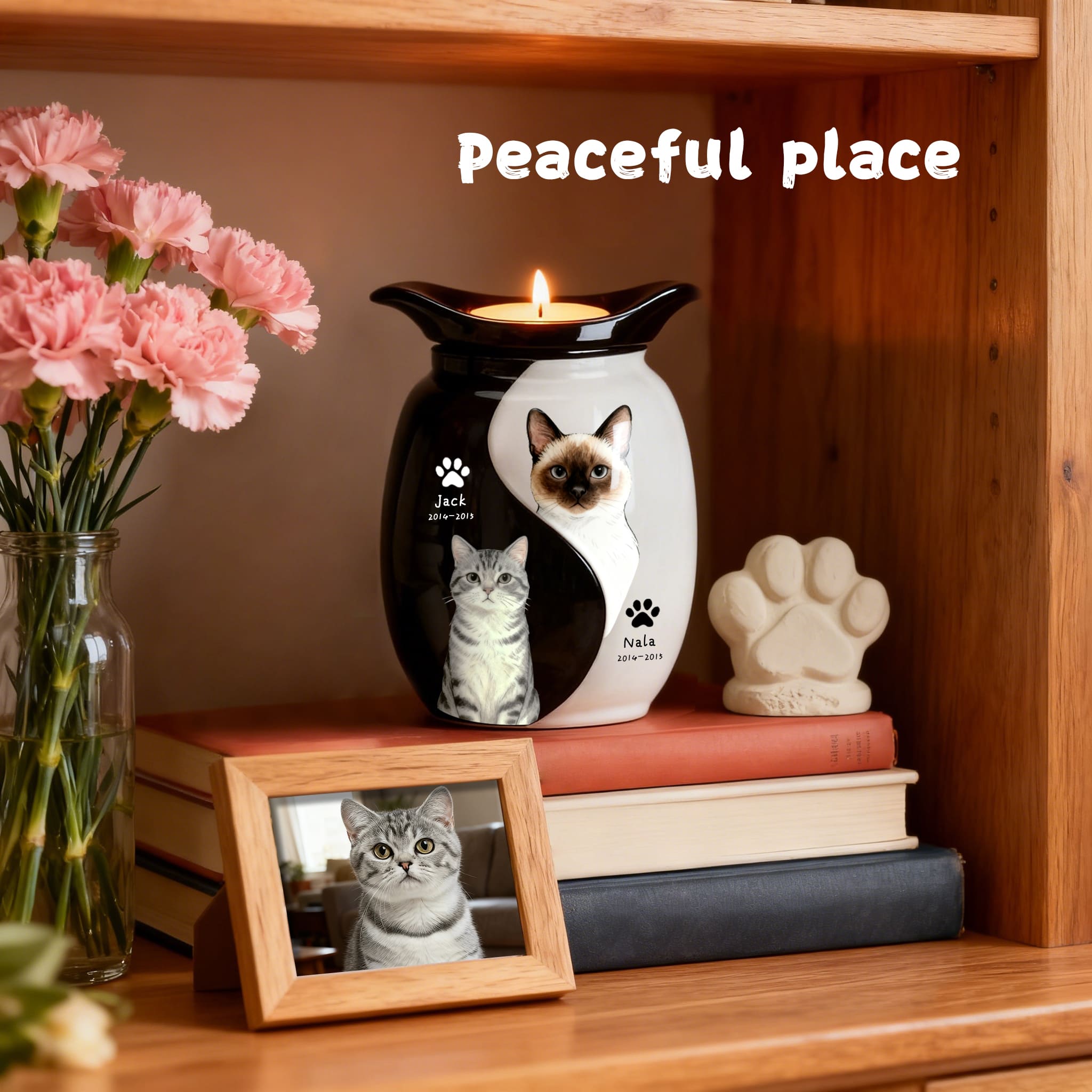 Double pet ashes urn with cat portraits, lit tealight top, paw-print decals