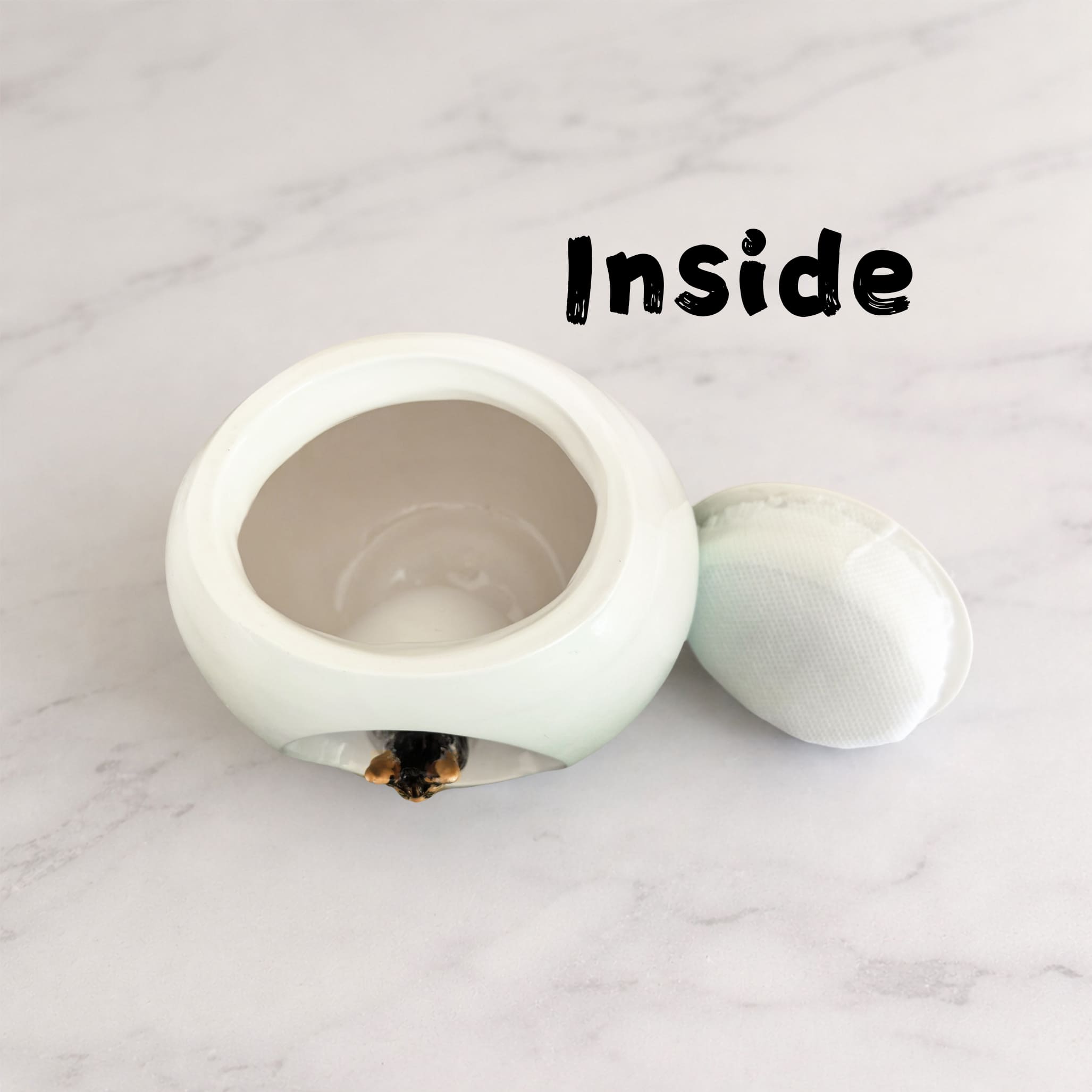 Ceramic pet memorial urn with removable lid, open hollow interior