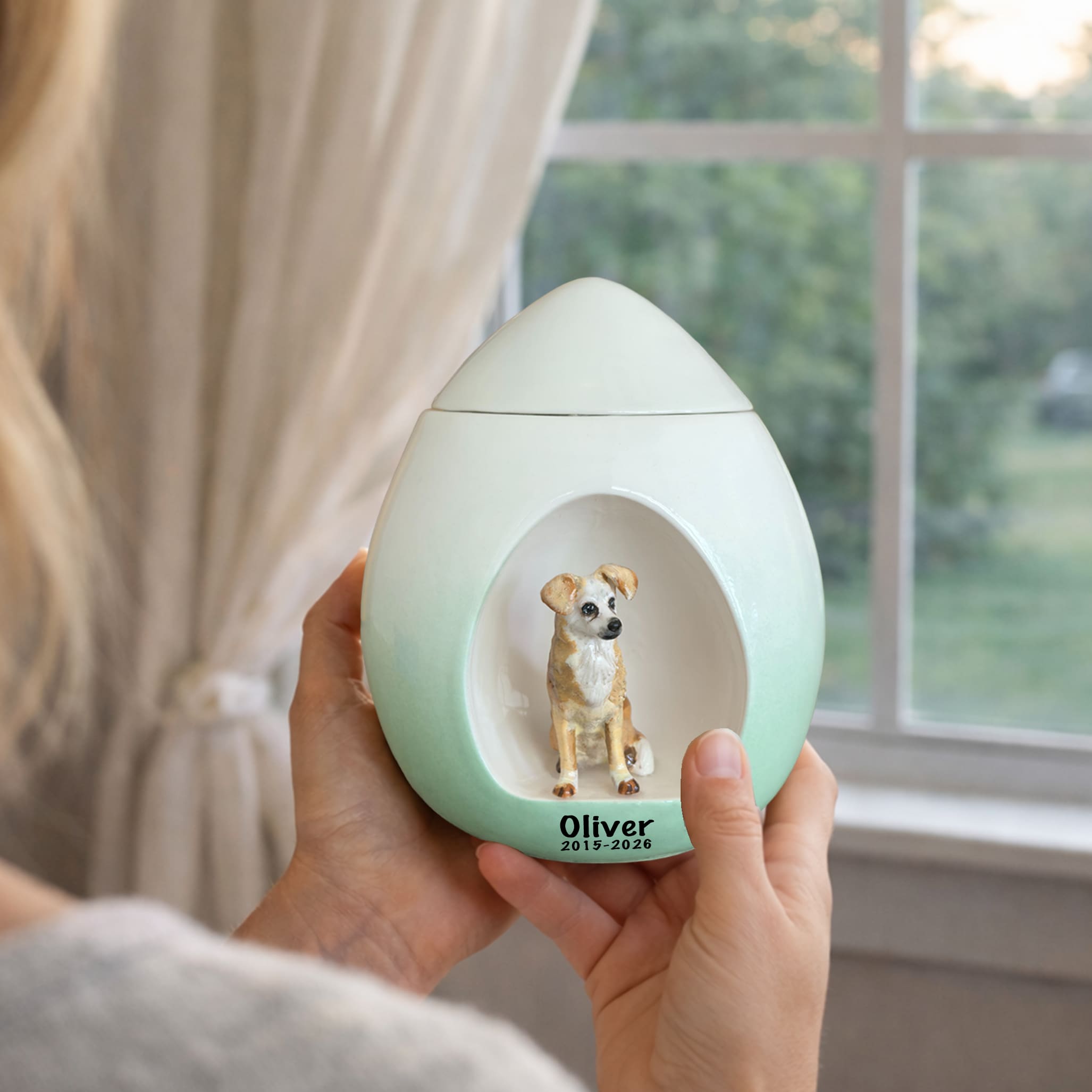 White and mint dog memorial urn with dog figurine and name plate