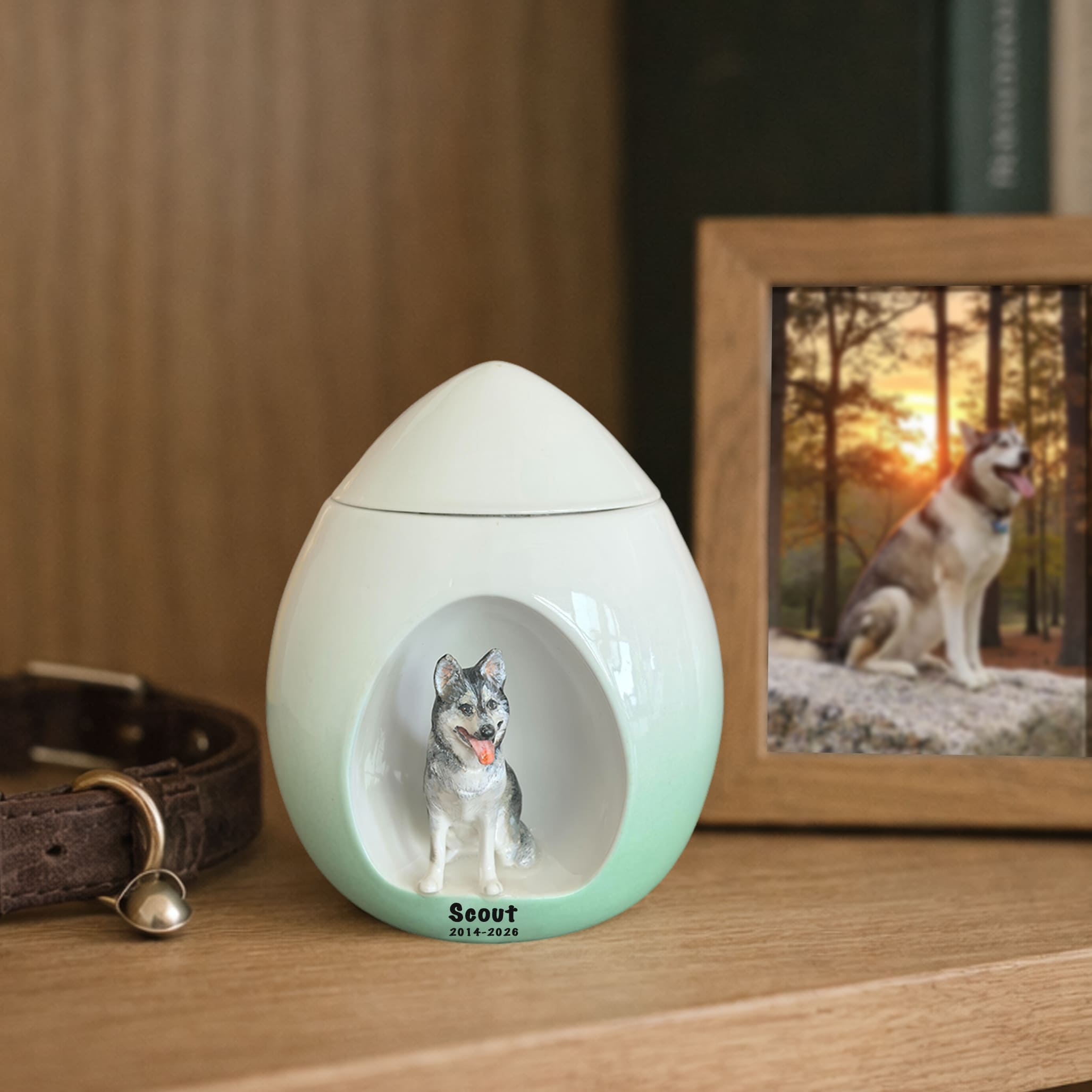 Green dog memorial urn with carved dog figure, inscribed Scout and dates