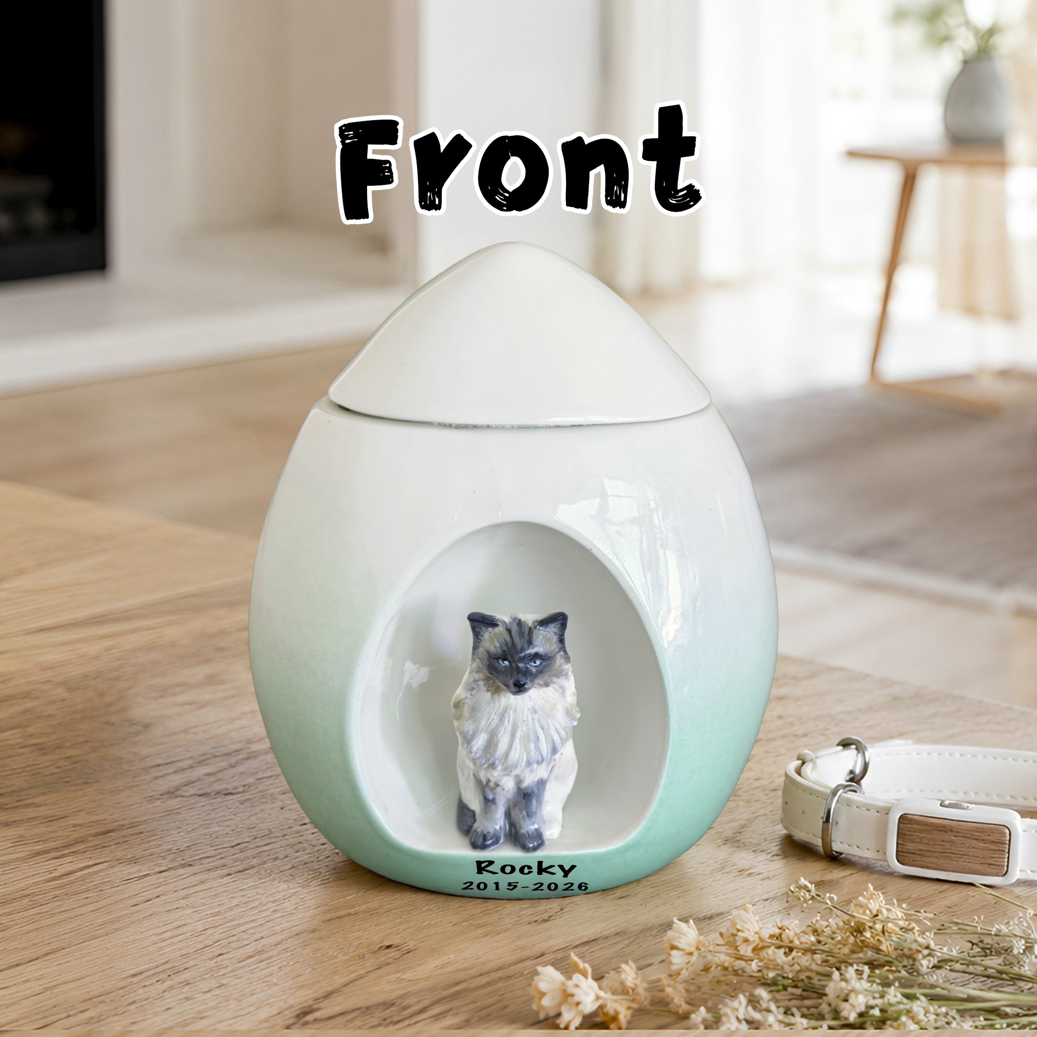 Front view of a custom cat urn for ashes with sculpted figurine, name and memorial dates