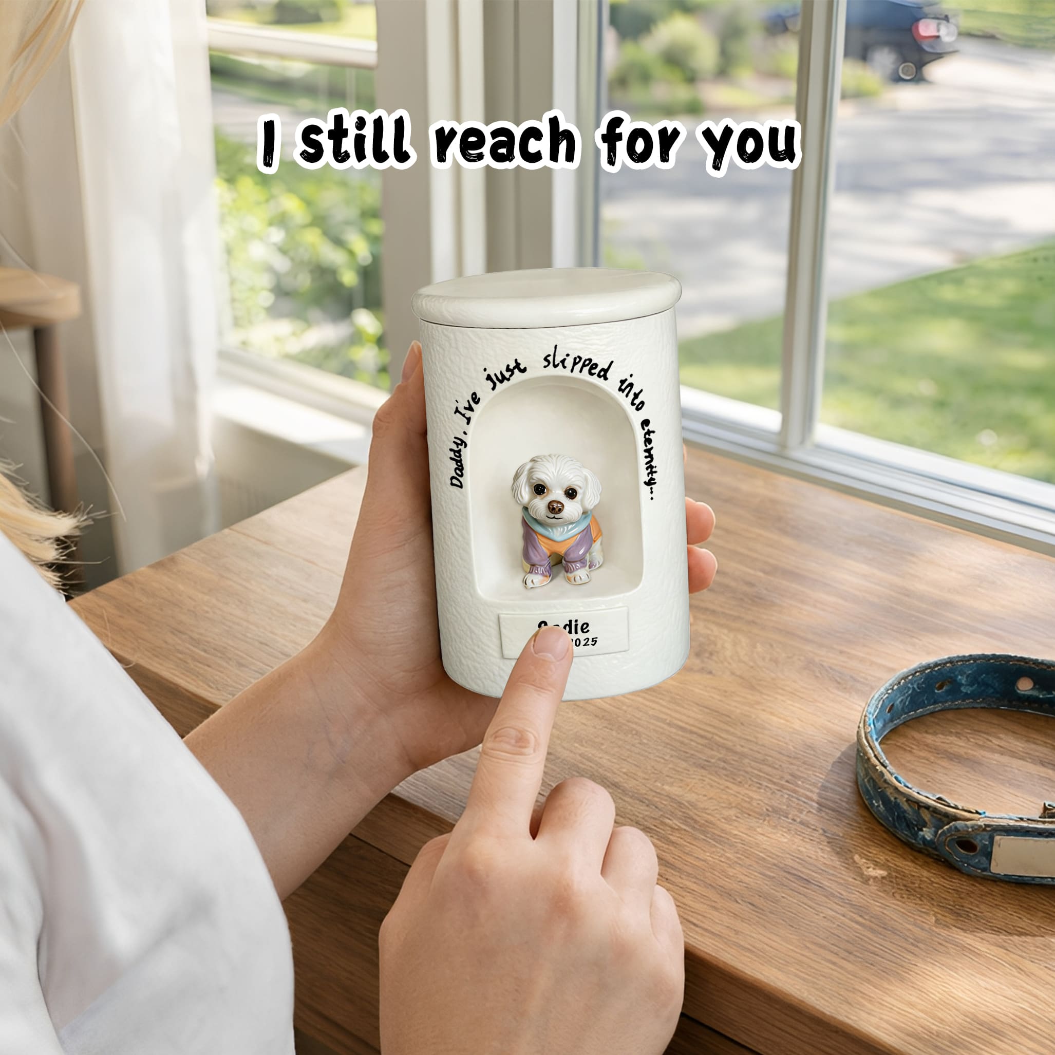 White ceramic dog urn with seated dog figurine relief and engraved name, held upright