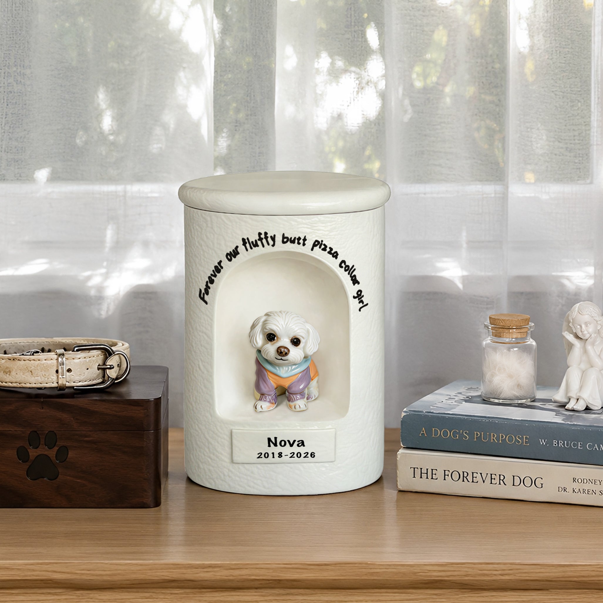 White ceramic dog memorial urn with seated dog portrait on front and engraved name/date