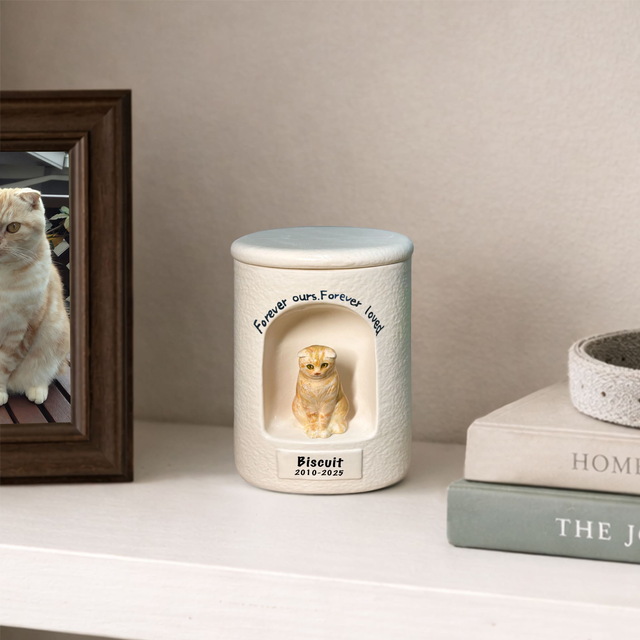 White memorial cat urn with sculpted cat figurine and engraved memorial text on front