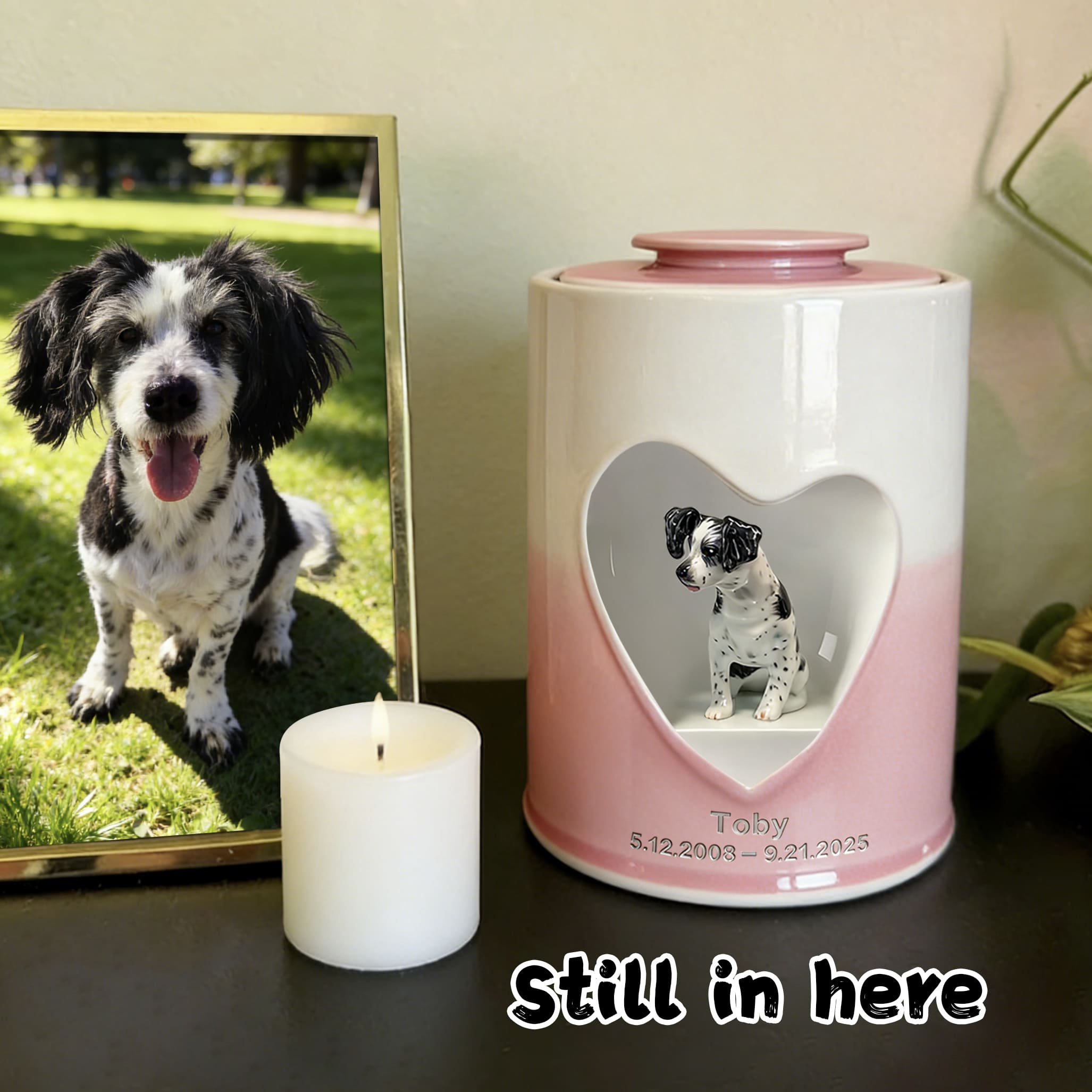 Pink and white dog urn with heart window showing black-and-white dog figurine