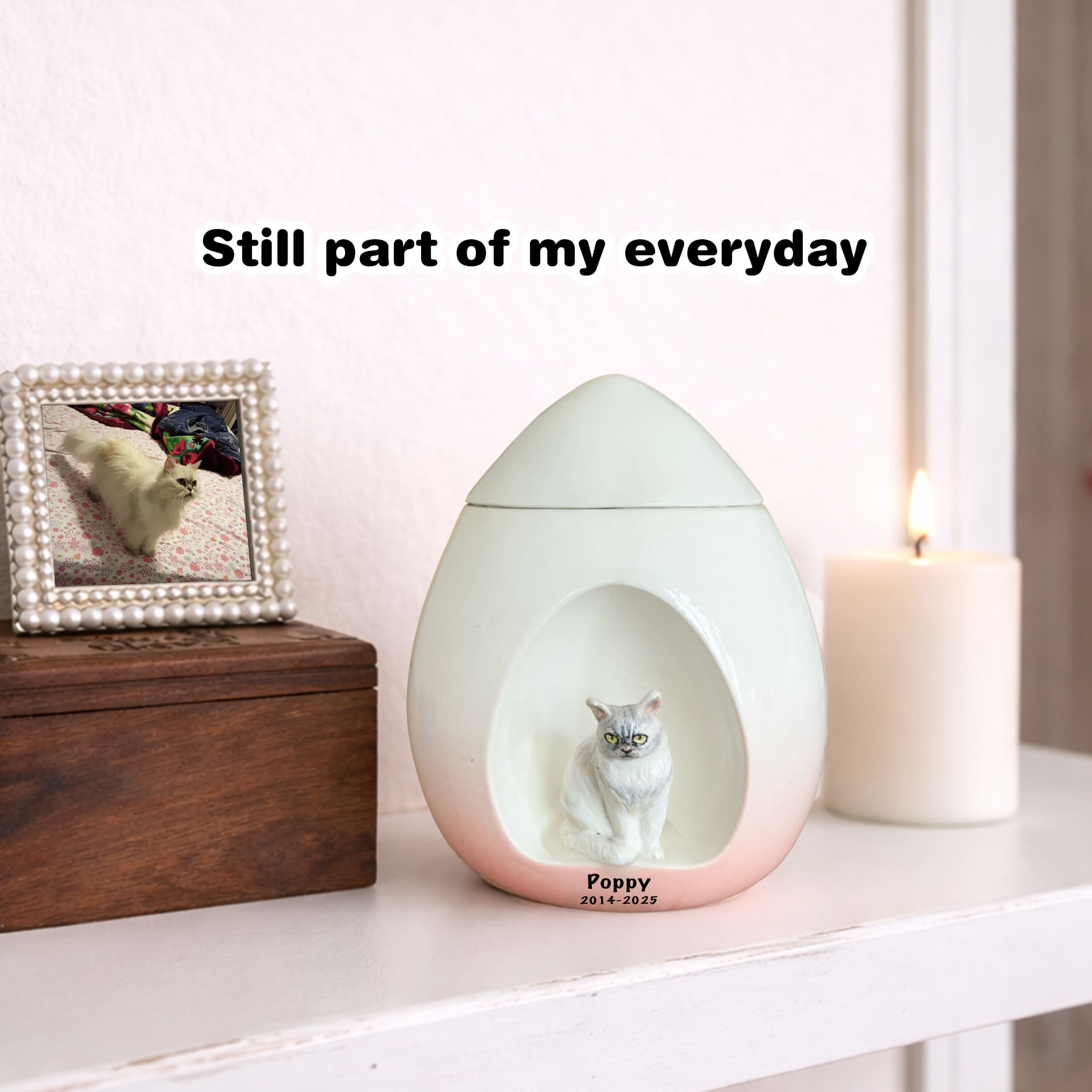 Light blue ceramic cat memorial urn shaped like an egg with cat portrait on front