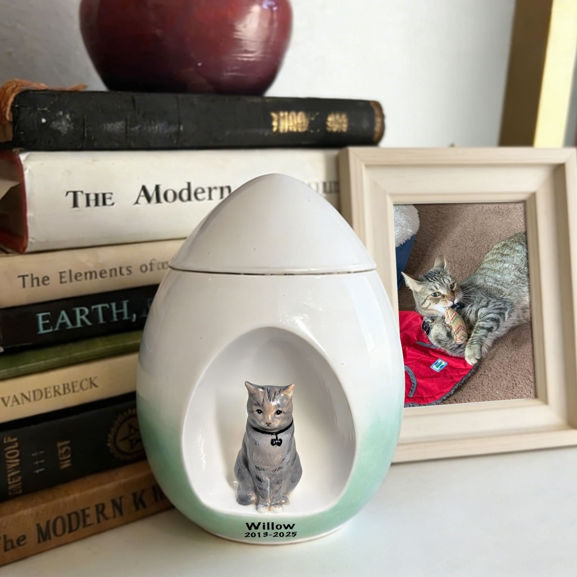 Mint green and white ceramic cat memorial urn with oval cat photo opening