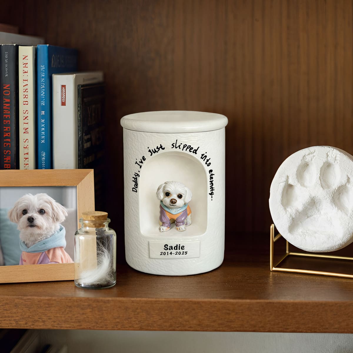 White ceramic dog urn cylinder with painted dog figurine and engraved memorial text
