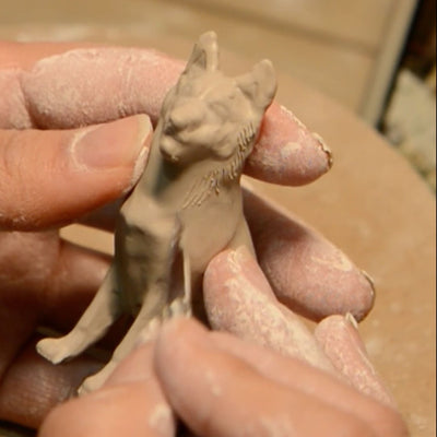 Hand sculpting process for a personalized ceramic dog urn